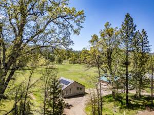 an overhead view of a house in a field with trees at Family-Friendly Yosemite Nest in Mariposa