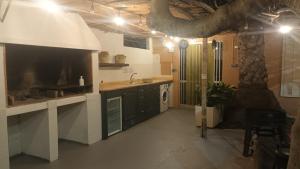 a large kitchen with a sink and a stove at Apartamento turístico in Orihuela Costa