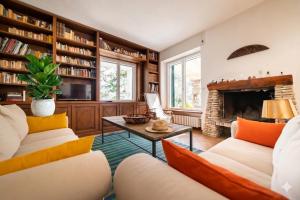 a living room with couches and a fireplace at Casa Liselotte in Imperia