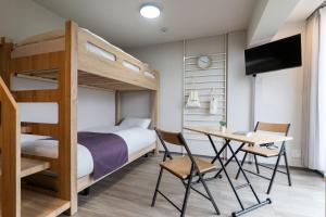 a bedroom with a bunk bed and a desk at BON Tokyo Kamata Parkside in Tokyo +18 photos