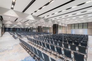 an empty auditorium with chairs and a screen at Hilton Mexico City Reforma in Mexico City +155 photos