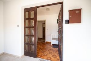 a door leading into a room with a hallway at Apartment Molnar in Žirovnica