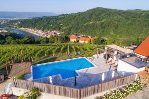 an image of a house with a swimming pool at Tri lučke Hotel & Restaurant in Krško