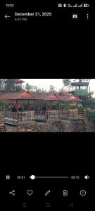 a picture of a park with a pavilion at DEVITHAN Resort in Dharān Bāzār