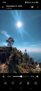 a view of a tree on top of a hill at DEVITHAN Resort in Dharān Bāzār