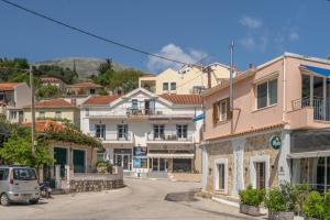 a street in a small town with buildings at Pilali Apartments Greece in Agia Effimia