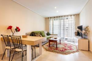a living room with a table and a couch at Patacona By The Beach in Valencia