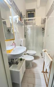a white bathroom with two sinks and a shower at Bungalow 97 in Fontane Bianche +57 photos