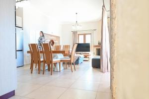 a kitchen and dining room with a table and chairs at Villa Selas Kalymnos in Kalymnos