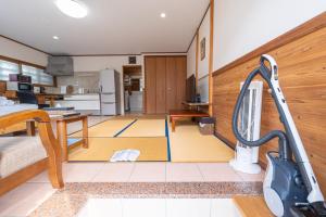 a kitchen and living room with a vacuum at ヴィラ結Miyakojima2 in Miyako-jima +20 photos