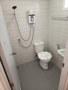 a bathroom with a toilet and a shower at The big market Resort in Jomtien Beach