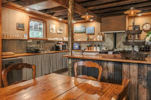 a kitchen with a wooden table and a wooden counter at The Barn Daylesford in Daylesford