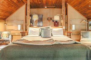 a bedroom with a large bed in a room at The Barn Daylesford in Daylesford