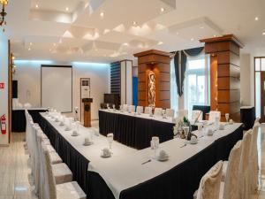a row of tables in a room with a screen at Dome Hotel in Kyrenia +34 photos