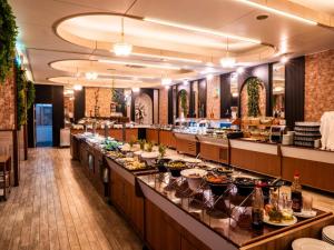 a buffet line in a restaurant with food at Dome Hotel in Kyrenia