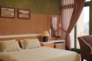a bedroom with a white bed and a window at Lam Home Tuần Châu in Ha Long
