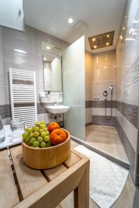 a bowl of fruit on a table in a bathroom at Hotel Varazdin in Varaždin +31 photos