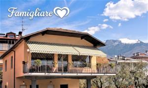 a building with a balcony in front of a mountain at R&B Casa Wanda since 1999 in Riva del Garda +67 photos