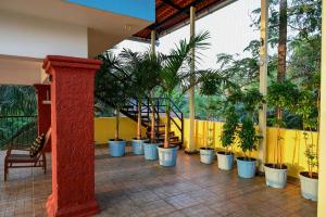 a row of potted plants in a building at Serenity by the Sea Goa in Silidao