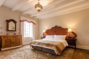 a bedroom with a large bed and a mirror at Portland Manor in Knysna +79 photos