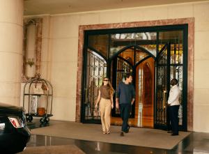people walking through a door in a building at Four Seasons Hotel Doha in Doha +57 photos