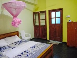 Postel nebo postele na pokoji v ubytování Randhi La Beach View Lounge