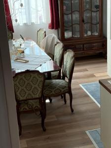 a dining room with a table and chairs at Haus Erika in Gamlitz