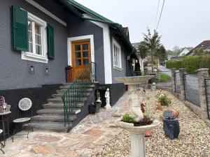 a house with a statue in front of it at Haus Erika in Gamlitz +4 photos