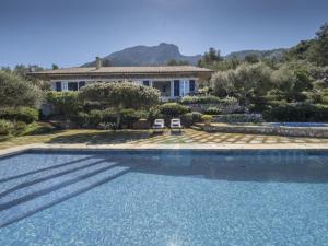 a house with a swimming pool in front of a house at M4R 03 Villa Maracanda, Banyalbufar in Banyalbufar