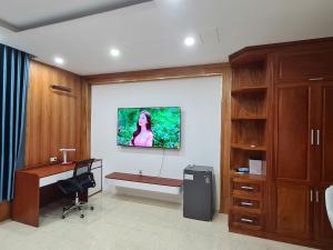 an office with a desk and a computer in a room at Viet Trung Hotel in Nhơn Trạch