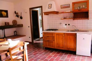 a kitchen with a sink and a counter top at Locanda Le Isole in Poggio al Pozzo +69 photos