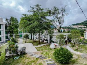 a view of a park with a building at city gezhi hotel in Guancun