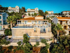 an aerial view of a house in a city at Villa Alis stunning sea view with Infinity Pool in Kaş