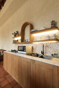a kitchen with a sink and a counter top at Princessa Villa by Raminten in Pakem