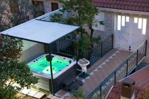 an overhead view of a hot tub on a balcony at Apartments Baltazar with Sea View&Jacuzzi in Dubrovnik