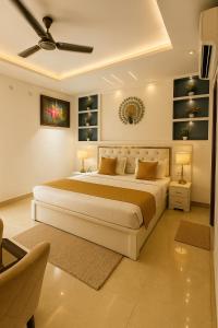 a bedroom with a large bed with two lamps at The Mayur Resort # Big Swimming Pool # Luxury Rooms # Garden # Playing Zone # Away From City Hustle # Property Of The Year # By Elegance # in Vrindāvan