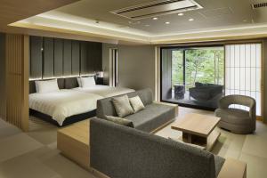 a bedroom with a bed and a living room at Hatsuhana in Hakone +61 photos