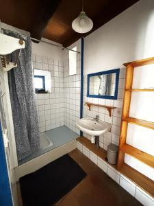 a bathroom with a sink and a shower and a tub at Longo maï in Vallon-Pont-dʼArc +67 photos