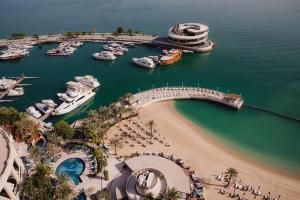 an aerial view of a marina with boats in the water at Four Seasons Hotel Doha in Doha