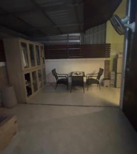 a dining room with chairs and a table in a room at Restaurant Mayuree in Kranuan
