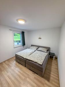 En eller flere senge i et værelse på Ferienwohnung Krones
