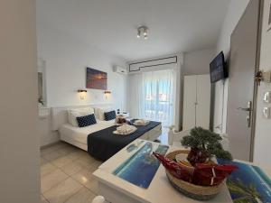 a living room with a couch and a table at Nautilus City Studios & Apartments in Rhodes Town +240 photos