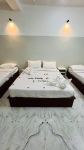 a bedroom with a large bed with a marble floor at Twinkle Clouds Home Stay in Chikmagalūr