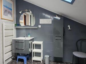 a bathroom with a sink and a mirror at Dom Gościnny KOJA in Kołobrzeg +59 photos