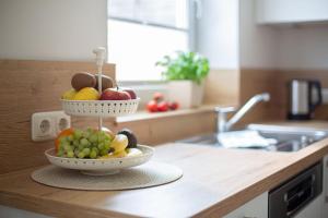 a bowl of fruit on a counter in a kitchen at Backhaus Ost in Bisdorf