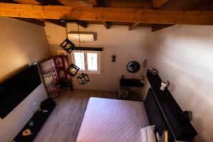 an overhead view of a room with a bed and a window at SENSEs VILLA SPA in Aghia Marina