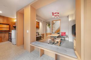 a kitchen and living room with a table and a dining room at 傅棧 Fu Yu in Tainan