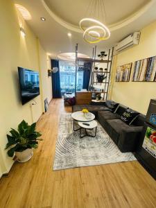 a living room with a couch and a table at Supper Location City view 3Br 5CG in Hanoi