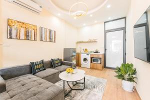 a living room with a couch and a table at Supper Location City view 3Br 5CG in Hanoi