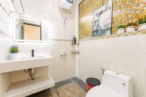 a bathroom with a sink and a toilet at Supper Location City view 3Br 5CG in Hanoi +11 photos